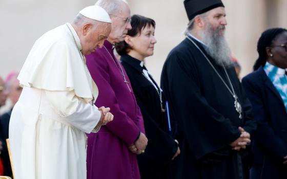 Pope Francis, Anglican Archbishop Justin Welby of Canterbury and the Rev. Ann Burghardt, general secretary of the Lutheran World Federation, join other Christian representatives for an ecumenical prayer vigil in St. Peter's Square Sept. 30, ahead of the assembly of the Synod of Bishops. (CNS/Lola Gomez)